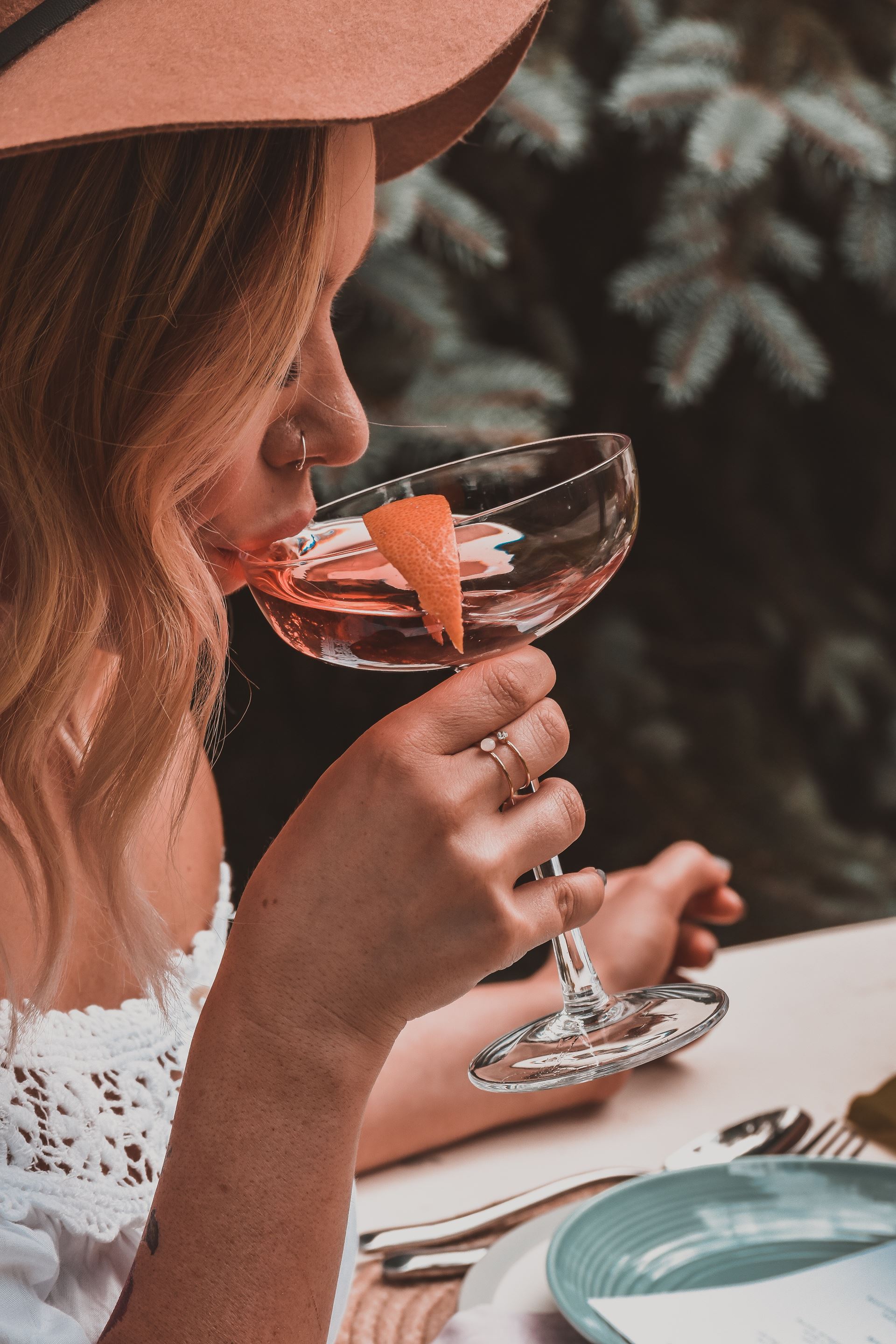 a woman holding a glass of wine